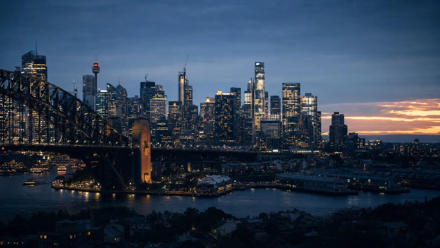 Sydney harbour and the city skyline at dusk